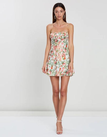 Model is wearing Prairie Floral Satin Mini Dress | VYEN